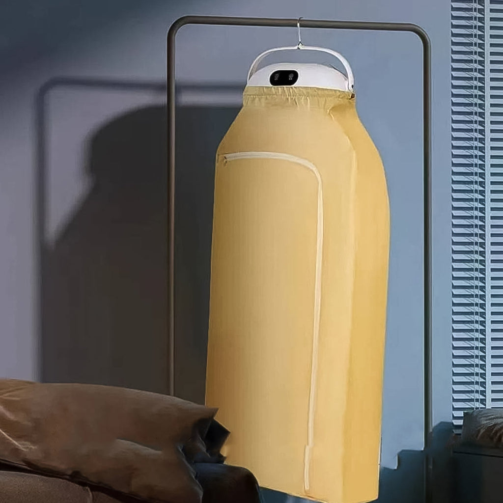 Yellow garment cover on a hanger against a neutral background
