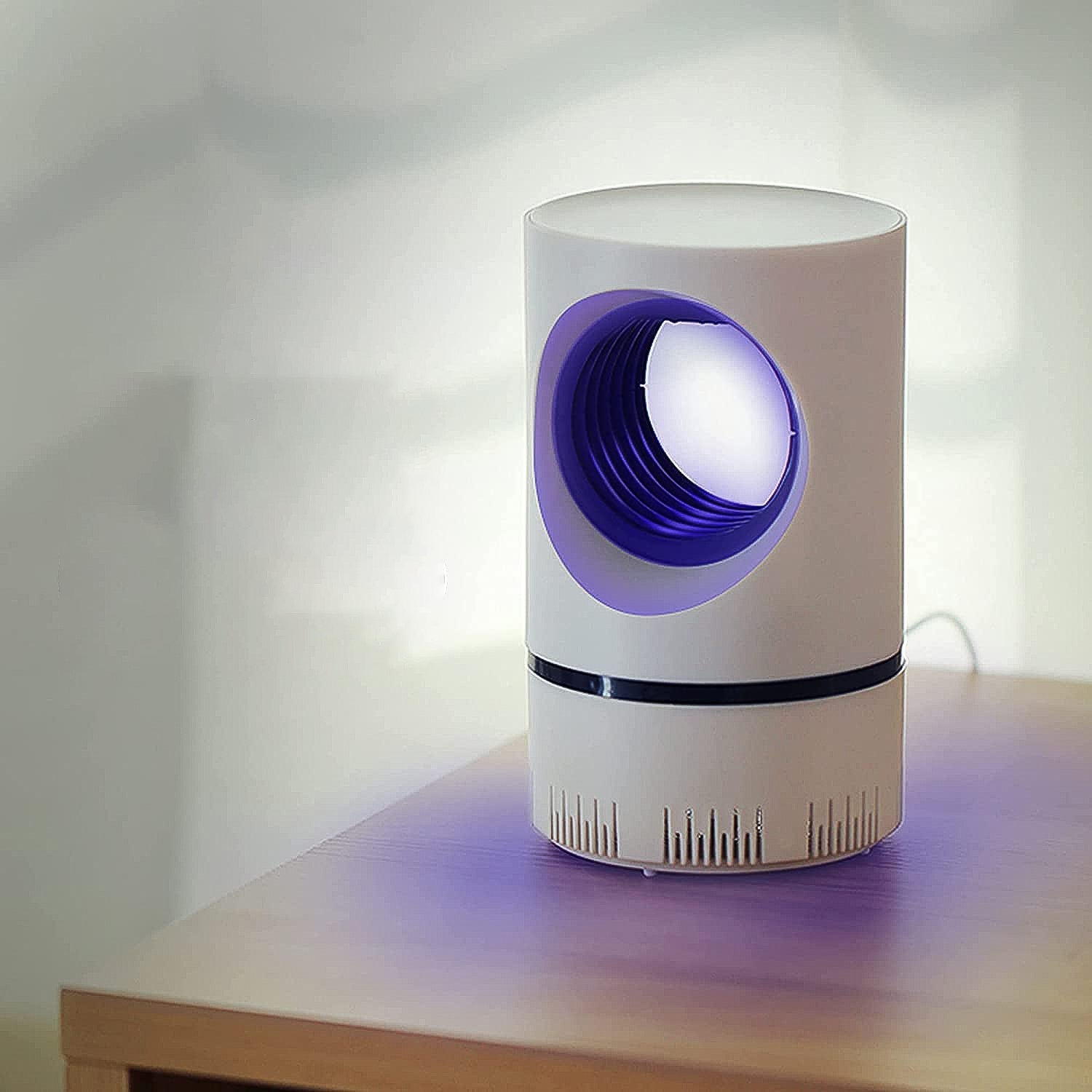White and purple lamp on a wooden surface with a neutral background