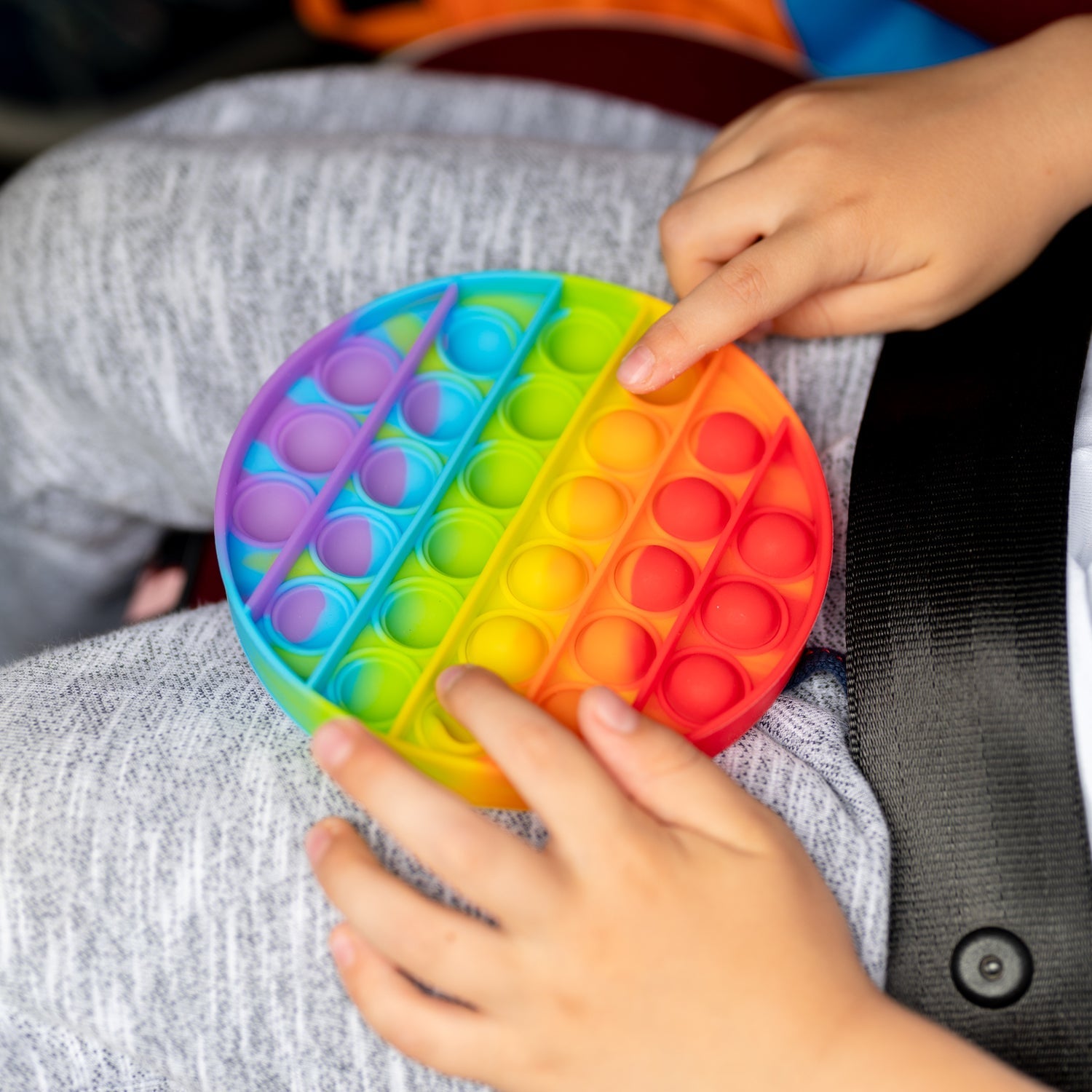 Round Fidget toy with colorful bubbles.